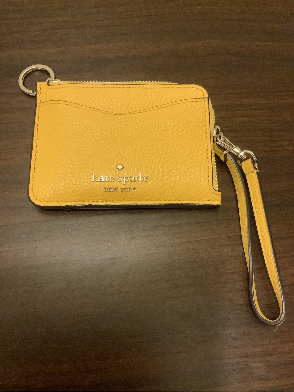 kate spade yellow pebbled leather wristlet card case with strap